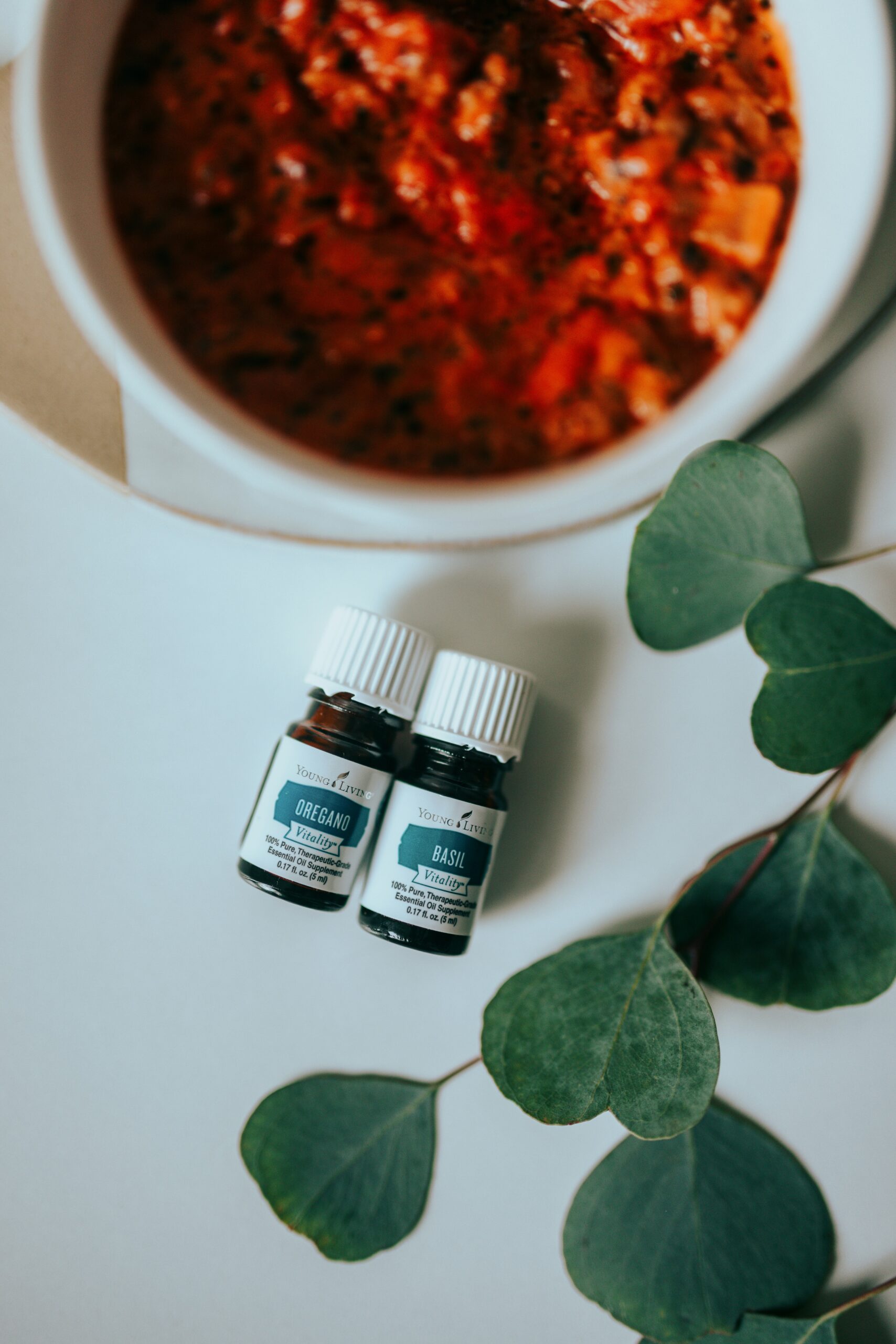 three white medicine bottles on white table